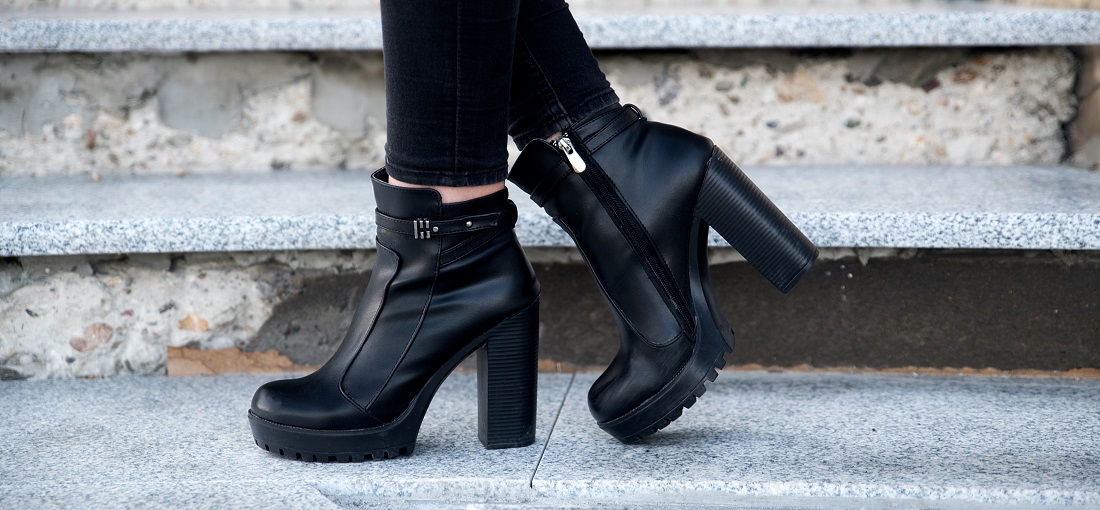 Woman wearing black boots